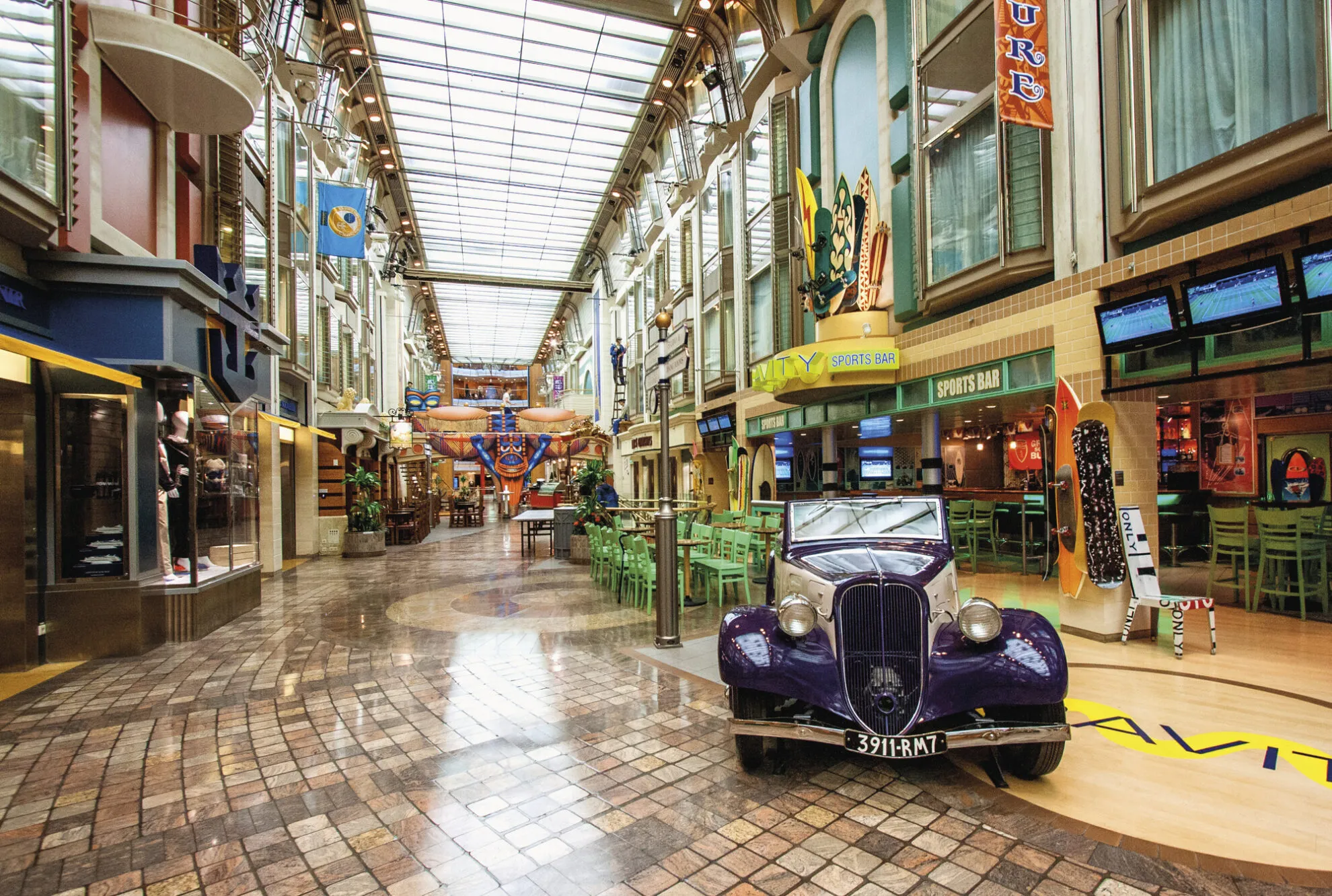 2491268-2417844-V1-P0 AD, Adventure of the Seas, Voyager class, Royal Promenade, shops, shopping, mall, entertainment, bar, antique car